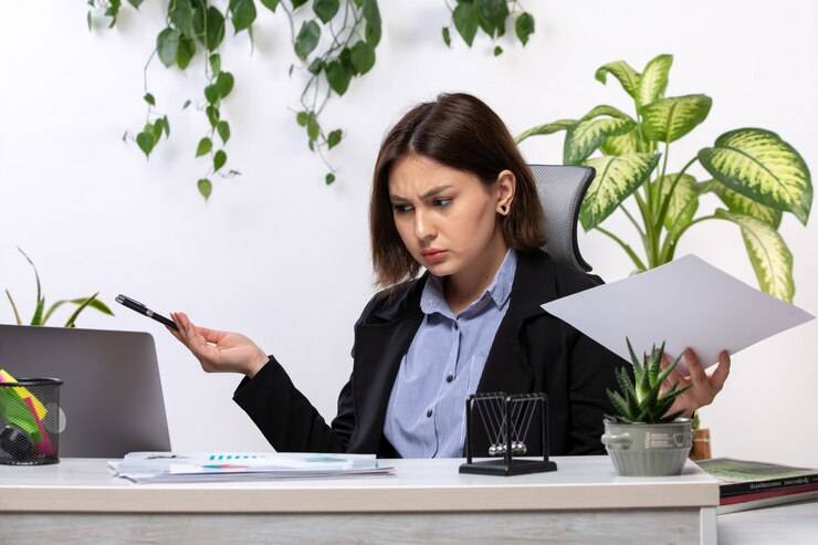 front-view-beautiful-young-businesswoman-black-jacket-blue-shirt-working-with-laptop-front-table-business-job-office_140725-15861